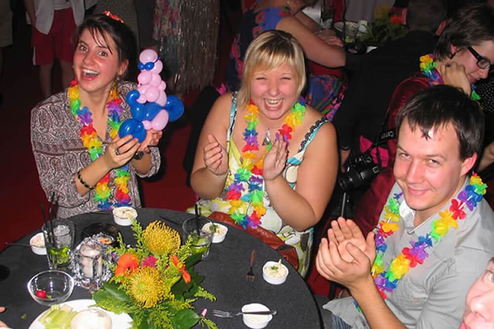 Young people enthusiastically applaud Tony's unique balloon sculpture.